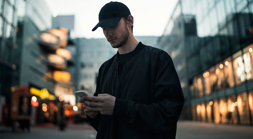man-in-black-holding-phone